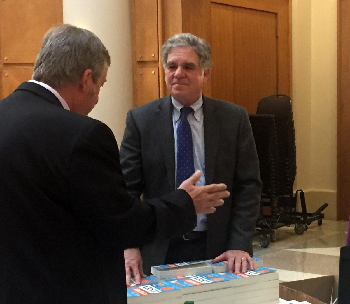 Pew Research Center Senior Fellow Paul Taylor signs copies of his book, &#8220;The Next America,&#8221; following his session in LSU&#8217;s &#8220;Moment or Movement&#8221; symposium.