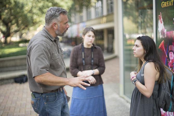 A member of Consuming Fire Fellowship speaks to a student on Sept. 27, 2016 in Free Speech Plaza.