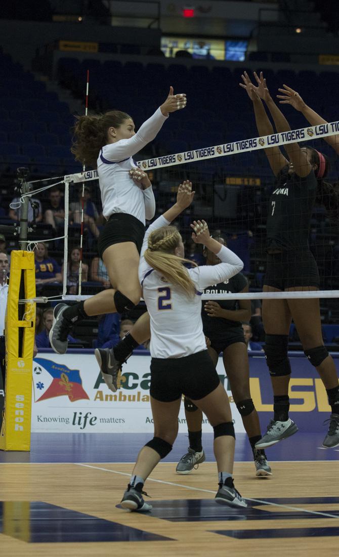 LSU sophomore middle blocker Tiara Gibson (6) hits the ball across the net during the Tigers' 3-1 loss against the University of South Carolina on October 16, 2016 at the Pete Maravich Assembly Center.