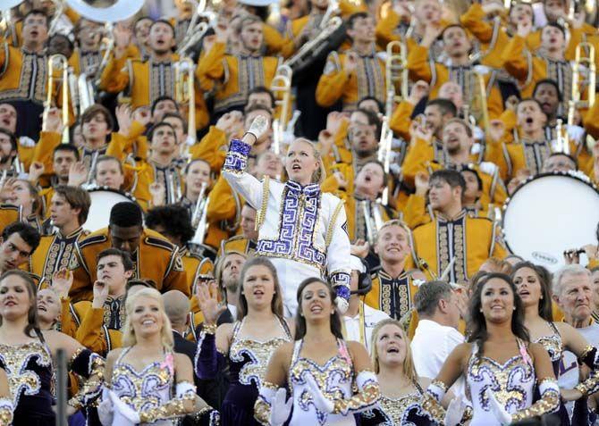 <p>LSU drum major, Mary Bahlinger, cheers on LSU with fellow Tiger Marching Band members in Tiger Stadium on Saturday, 25, 2014 where LSU won 10-7 against Ole Miss.</p>