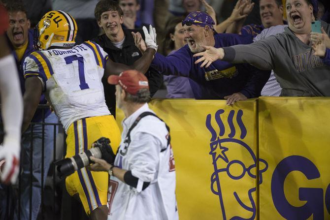 LSU junior running back Leonard Fournette (7) celebrates a touchdown with fans on Saturday Oct. 22, 2016 during the Tigers' 38-21 victory over Ole Miss at Tiger Stadium.