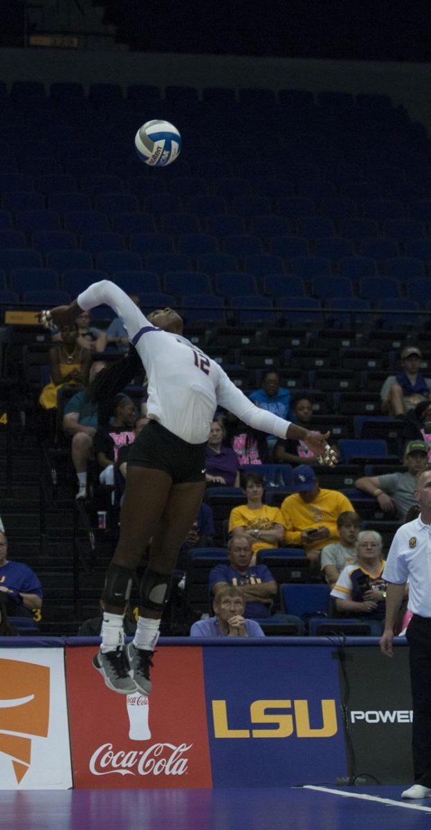 LSU junior outside hitter Gina Tillis (12) jumps to spike the ball during the Tigers' 3-1 loss against the University of South Carolina on October 16, 2016 at the Pete Maravich Assembly Center.