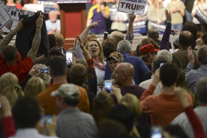 Supporters of Republican presidential candidate Donald J. Trump turn to the media on Thursday, Feb. 11, 2016, during a rally hosted in the Baton Rouge River Center.