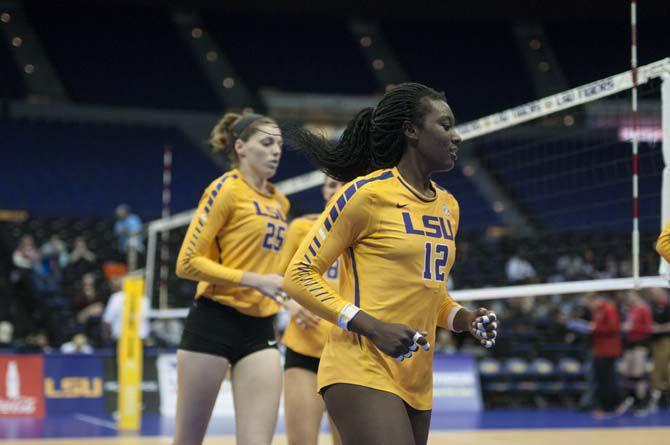 LSU junior outside hitter/right side hitter Gina Tillis (12) and sophomore outside hitter and right side Toni Rodriguez (25) swap sides during between sets during the Lady Tigers' 3-2 victory over the University of Georgia on Friday Nov. 11, 2016 at the Pete Maravich Assembly Center.