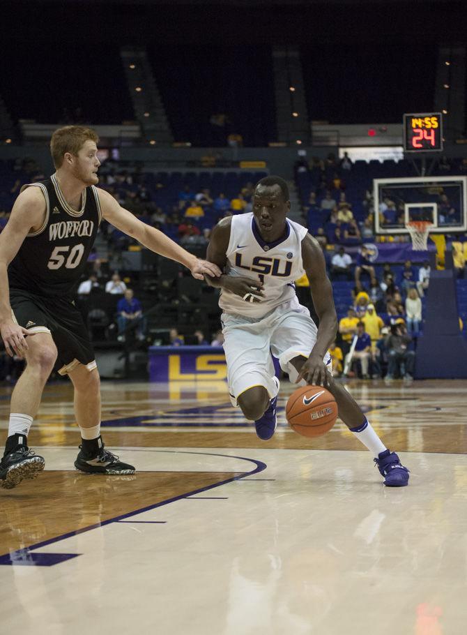 LSU junior forward Duop Reath (1) drives on Wofford defenders during the Tigers' 91-69 win against Wofford on Nov. 12, 2016 in the PMAC.