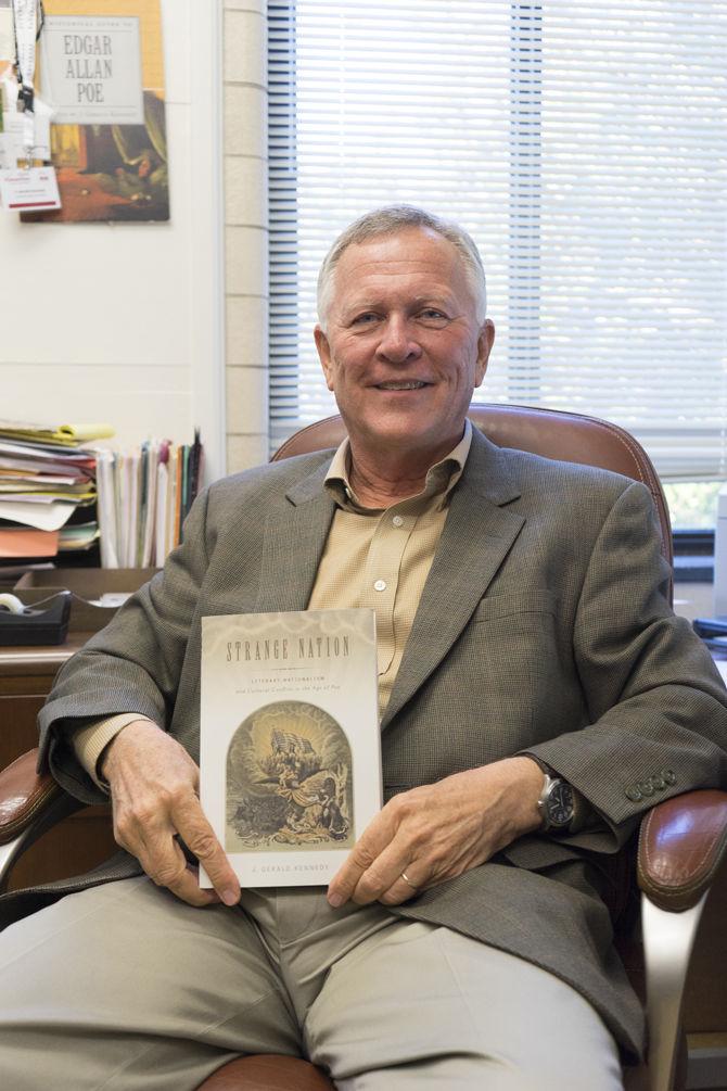 University Boyd Professor of English J. Gerald Kennedy reclines with his latest work, Strange Nation, on Nov. 21, 2016 in his office in Allen Hall.