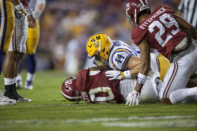 LSU junior fullback, J.D. Moore (44), tackles Alabama junior linebacker, Shaun Hamilton (20), in the 0-10 LSU loss against Alabama on Saturday, Nov. 5, 2016, in Tiger Stadium.