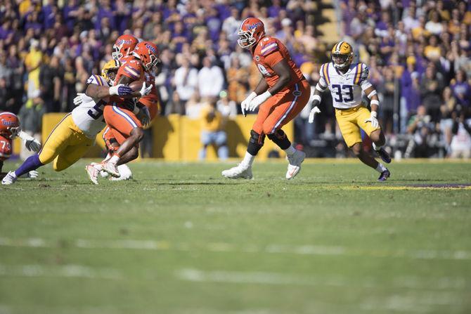 LSU junior defensive end Davon Godchaux (57) brings down a Gator during the Tigers' 16-10 loss to the Florida Gators on Saturday Nov. 19, 2016 at Tiger Stadium.