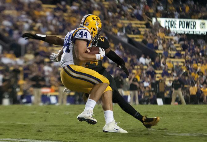 LSU junior fullback J.D. Moore (44) runs the ball during the Tigers' 42-7 victory against Missouri on Saturday, Oct. 1, 2016 in Tiger Stadium.