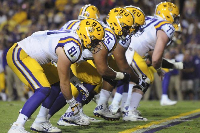 LSU senior tight end Colin Jeter (81), sophomore offensive guard Maea Teuhema (75) and senior offensive guards Josh Boutte (76) and Ethan Pocic (77) position themselves on the line of scrimmage on Saturday, Oct. 1, 2016, during the Tigers' 42-7 victory against Missouri in Tiger Stadium.