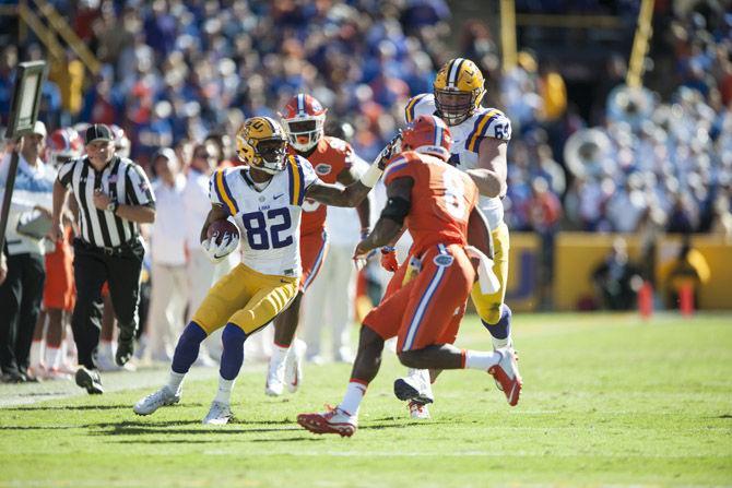 LSU junior wide receiver D.J. Chark (82) runs the ball down field during halftime against University of Florida on Nov. 19, 2016, at Death Valley.