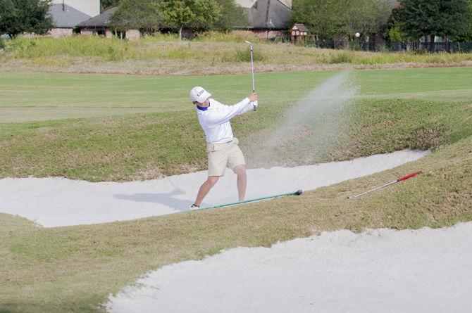 LSU junior golfer Blake Caldwell hits out of a sand trap during the second day of the Tom Davids Intercollegiate tournament on Oct. 9, 2016 at the University Club golf course.