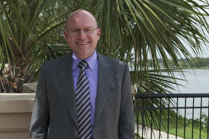 LSU Foundation's President and CEO Stephen Moret stands beside the LSU lakes on Wednesday, Sept. 9, 2015, on LSU's campus.