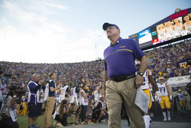 LSU special teams coordinator Bradley Dale Peveto leads the team onto the field on Saturday, Oct. 1, 2016, during the Tigers' 42-7 victory against Missouri in Tiger Stadium.