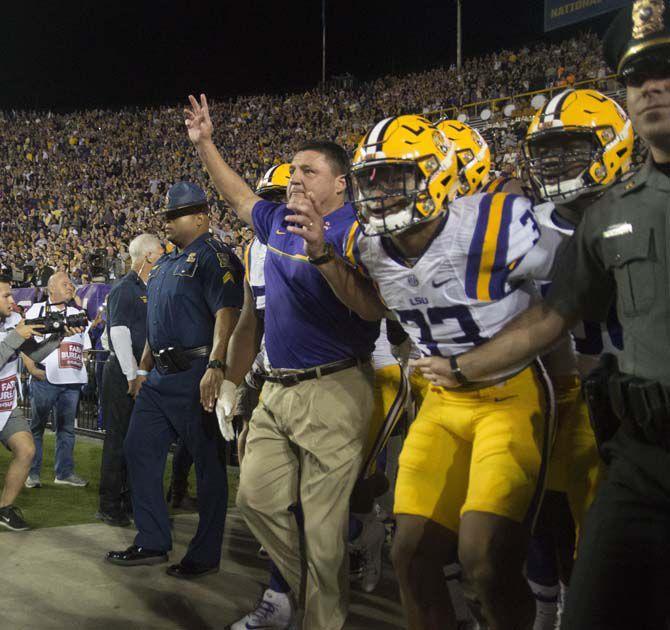 LSU head coach Ed Orgeron leading his team onto the field during Tigers' 38-21 Victory against University of Mississippi on Oct. 22, 2016, in Death Valley.