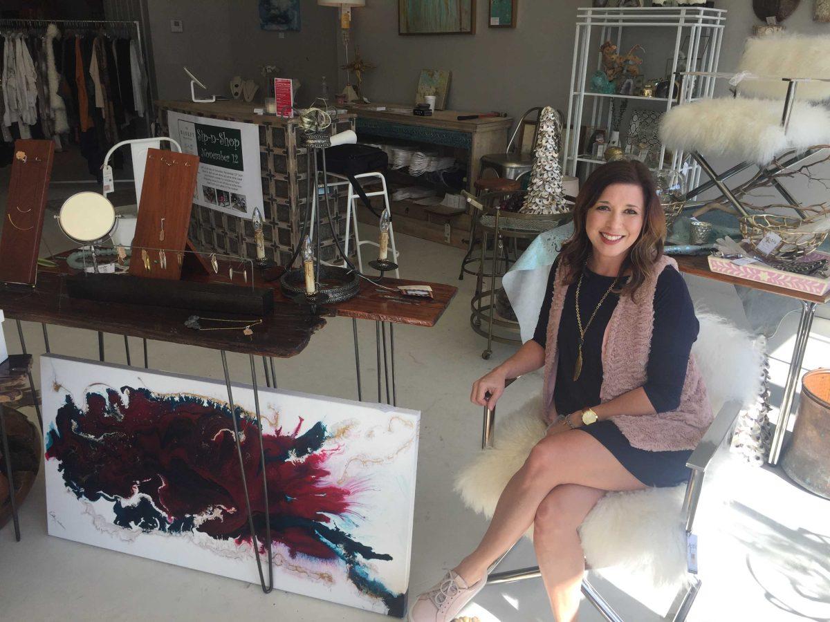 The Market Magazine &amp; Sixth Owner&#160;Amy Radle sits in the store on Magazine Street around some of the merchandise available to shoppers.