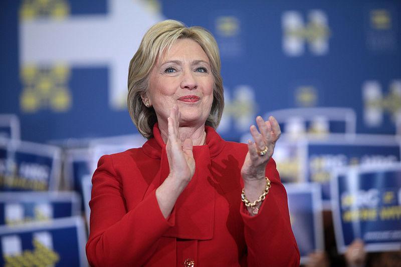 Former Secretary of State Hillary Clinton speaking with supporters at a "Get Out the Caucus" rally at Valley Southwoods Freshman High School in West Des Moines, Iowa.