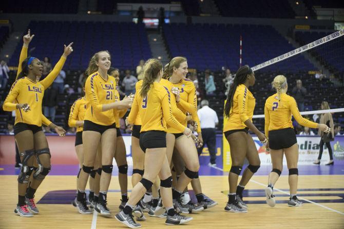 The team celebrates after their 3-2 victory over the University of Georgia on Friday Nov. 11, 2016 at the Pete Maravich Assembly Center.