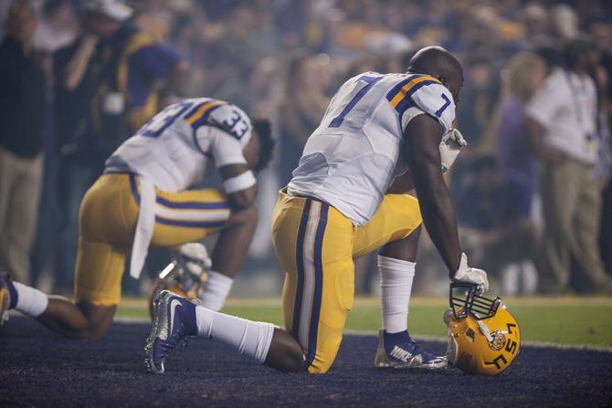 LSU junior running back, Leonard Fournette (7) and junior safety, Jamal Adams (33), take a kneel before the 0-10 LSU loss against Alabama on Saturday, Nov. 5, 2016, in Tiger Stadium.