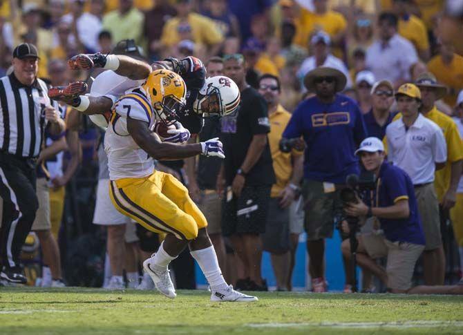 <p>LSU sophomore running back Leonard Fournette (7) rams Auburn sophomore defensive back Tray Matthews (28) during the Tigers' 45-21 victory against Auburn on Saturday, Sept.19, 2015, in Tiger Stadium.</p>