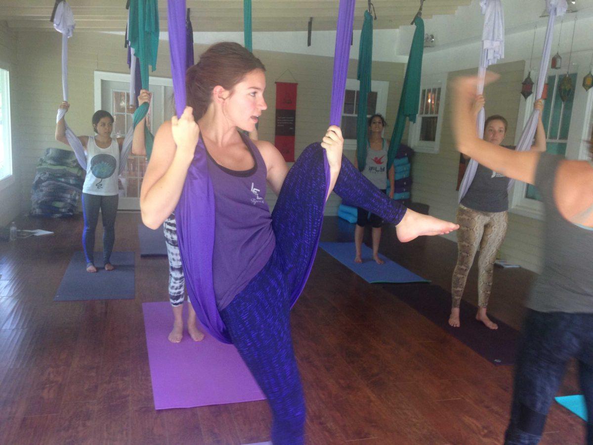 Allyson Huval performs a pose during an aerial yoga class.&#160;