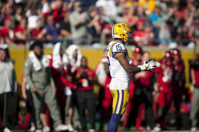 LSU junior wide receiver Malachi Dupre (15) awaits the next play on Saturday, Dec. 31, 2016, during the Tigers' 29-9 Buffalo Wild Wings Citrus Bowl win against Louisville at Camping World Stadium in Florida.