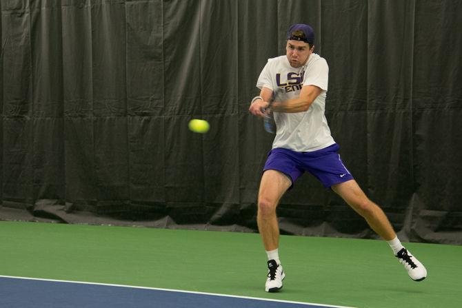 LSU junior Jordan Daigle returns the ball during LSU's defeat against the University of Alabama on Friday, March 18, 2016 at the LSU Tennis Facility