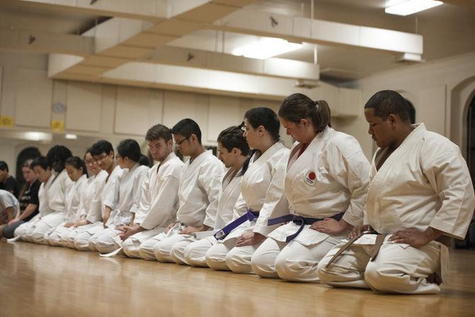 Karate students end practice by lining up for meditation during in the Huey P. Long Field House on Jan. 25, 2017.