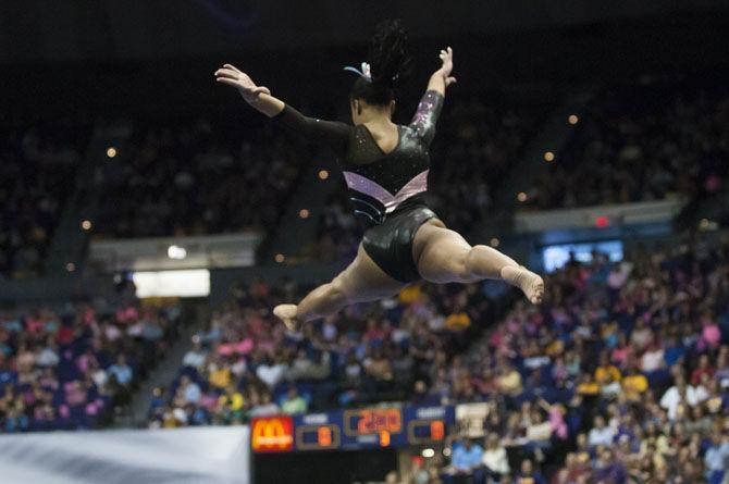 LSU all-around freshman gymnast Kennedi Edney leaps across the balance beam during the Tigers' 197.475-192.625 victory over Texas Women's University on Friday, Jan. 20, 2017, in the Pete Maravich Assembly Center.