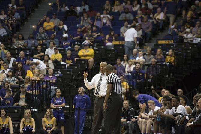 LSU men's basketball coach Johnny Jones discusses a call with a referee during the Tigers' 81-66 loss to Alabama on Saturday, Jan. 14, 2017 in the PMAC.