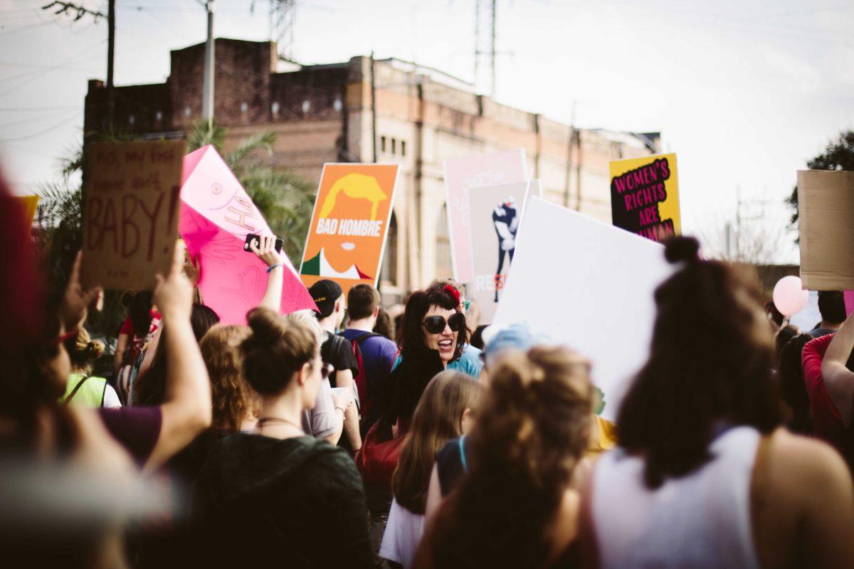 Protesters march while holding a variety of signs Saturday, Jan. 21 during the New Orleans Women's March.