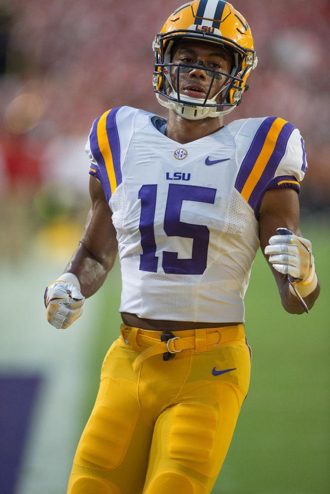 LSU junior wide reciever Malachi Dupre (15) warming up before the Tigers' matchup against Jacksonville State on Saturday, Sept. 10, 2016, where the Tigers would lead by a 17 point margin of 27-10 going into halftime.