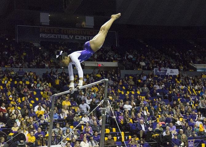 LSU freshman gymnast Kennedi Edney clings to the bar during the Tigers 197.825-193.600 victory over the Georgia Bulldogs on Friday, Jan. 6, 2017 in the Pete Maravich Assembly Center.