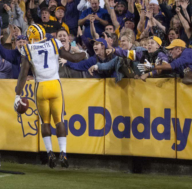 LSU junior running back Leonard Fournette (7) celebrating with the crowd after scoring a touchdown during Tigers' 38-21 Victory against University of Mississippi on Oct. 22, 2016, in Death Valley.