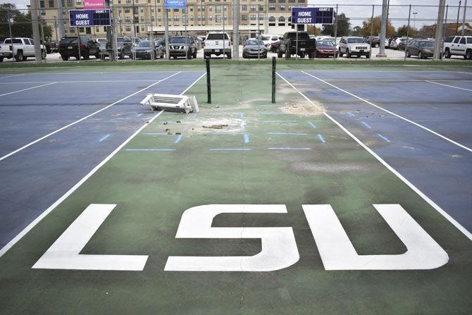 The LSU lettering stands strong while debris clutters the tennis courts on Jan. 13, 2017, at the corner of West Chimes Street and Dalrymple Drive.