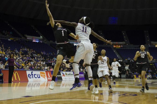 LSU junior guard Raigyne Moncrief (11) attempts to block the University of South Carolina junior guard Bianca Cuevas-Moore (1) during the Tigers' 84-61 loss against the Gamecocks on Sunday, Jan. 15, 2017, in the PMAC.