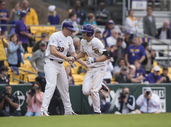 LSU freshman infielder Jake Slaughter (5) trots around the bases after hitting a home run during the Tigers' 9-0 win against Army on Saturday, Feb. 18, 2017 at Alex Box Stadium.