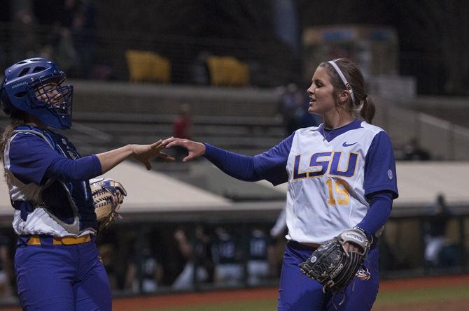 LSU junior pitcher Baylee Corbello (9) and Sahvanna Jaquish (2) interact between innings during game two of the Tigers&#8217;1-0 victory against Longwood University on Tuesday, Mar. 8, 2016 in Tiger Park.