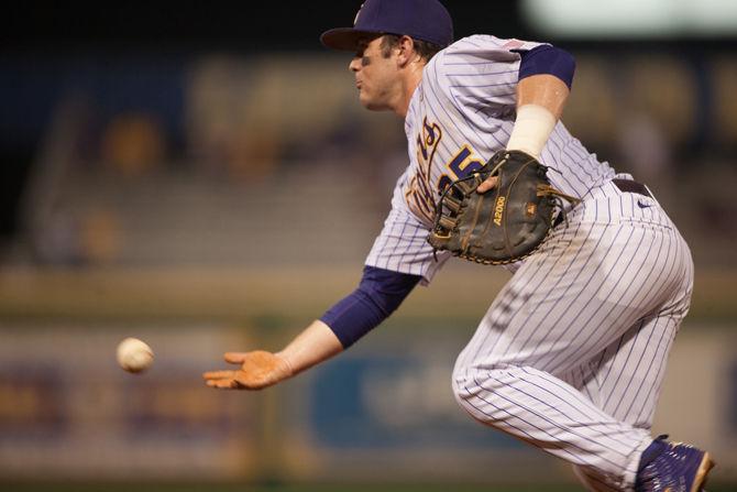 LSU sophmore infielder Bryce Jordan (25) tosses the ball to first base during LSU's 9-4 victory against the University of New Orleans on Wednesday, March 16, 2016