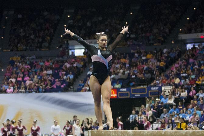 LSU all-around sophomore Sarah Finnegan performs her balance beam routine during the Tigers' 197.475-192.625 victory over Texas Women's University on Friday, Jan. 20, 2017, in the Pete Maravich Assembly Center.