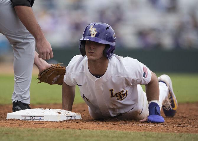 LSU sophomore outfielder Brennan Breaux (6) slides back into first base during a pick-off attempt during the Tigers' 9-0 win against Army on Saturday, Feb. 18, 2017 at Alex Box Stadium.