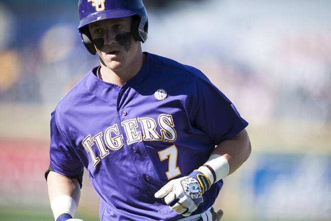 LSU sophomore infielder Greg Deichmann (7) runs between bases on Saturday, March 5, 2016, during the Tigers' 15-1 win against Fordham at Alex Box Stadium.