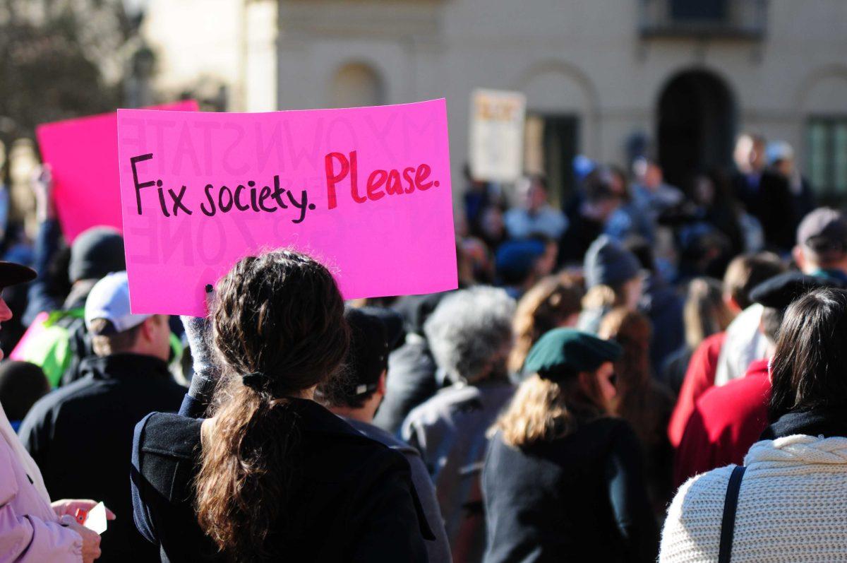 Protesters gather on Saturday, Jan. 24, 2015 before the 'Organize, Reflect, Act 2015' march from the Memorial Tower to the Pete Maravich Assembly Center.