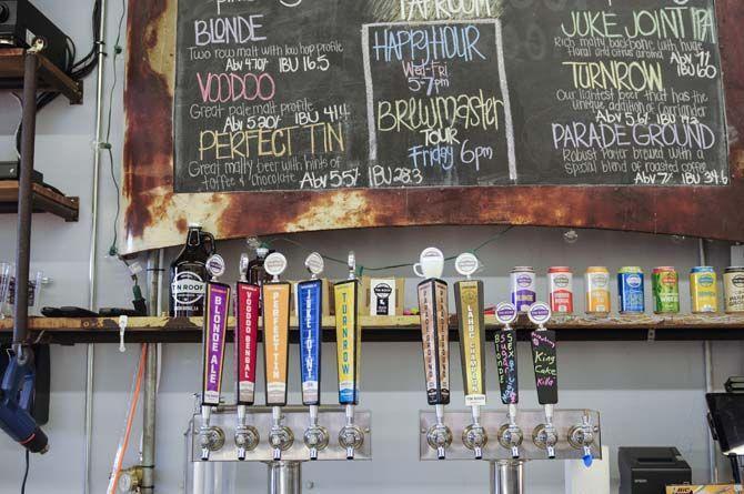 Tin Roof Brewing Company offers various custom beers on tap inside their tap room.