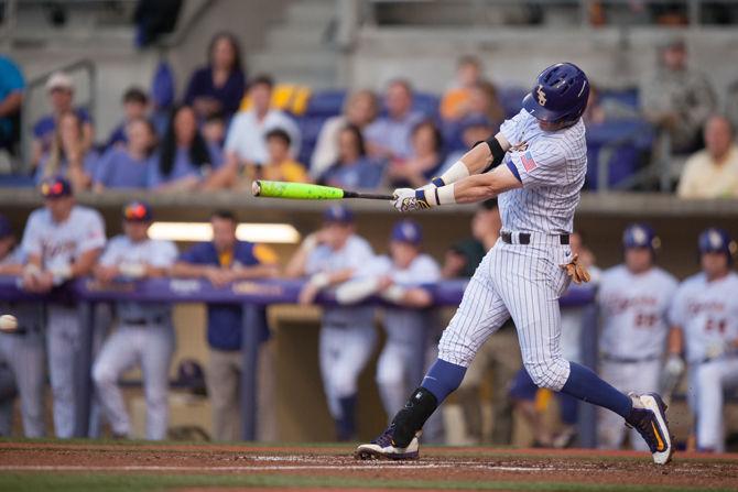 LSU sophmore infielder Greg Deichmann (7) bats during LSU's 14-11 victory on Wednesday, April 13, 2016 at Alex Box Stadium