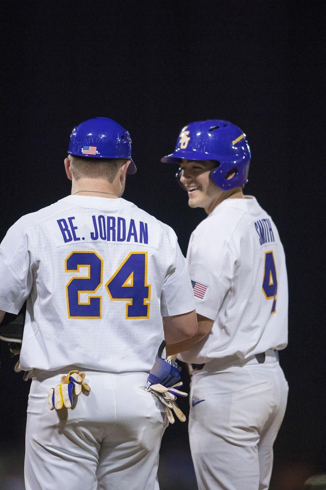 LSU freshman infielder Josh Smith (4) and LSU junior outfielder Beau Jordan (24) joke at first base on Friday, Feb. 24, 2017, during the Tigers 6-1 victory over Maryland at Alex Box Stadium.