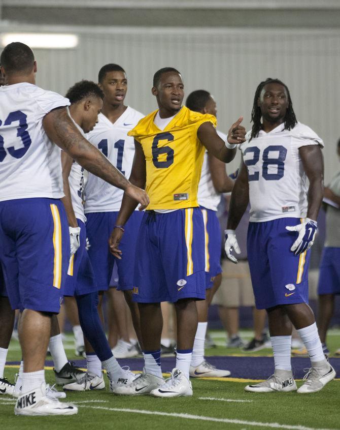 LSU junior quarterback Brandon Harris (6) recieves the play and signals a thumbs up on Sept. 26, 2016 at the Indoor Football Facility.