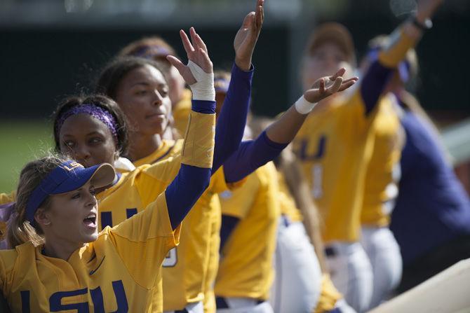 Members of the LSU softball team pump up the crowd during the Tigers' 5-2 victory over OSU on Sunday, Feb. 12, 2017, at Tiger Park.