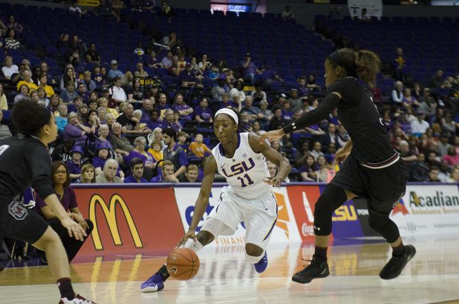 LSU junior guard Raigyne Moncrief (11) dribbles around a South Carolina player during the Lady Tigers' 84-61 loss against the University of South Carolina on Sunday, Jan. 15, 2017, in the PMAC.&#160;