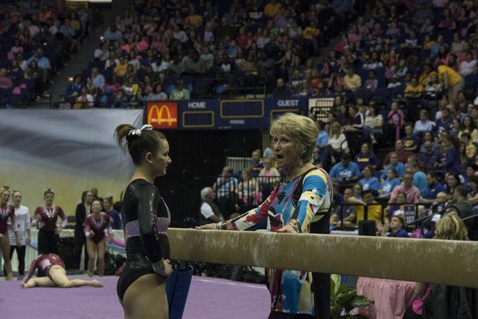 LSU all-around sophomore gymnast Sarah Finnegan speaks with D-D Breaux before performing her balance beam routine during the Tigers' 197.475 - 192.625 win over Texas Woman's University on Friday, Jan. 20, 2017 in the Pete Maravich Assembly Center.